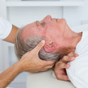 Osteopathy used to gently stretching a patient's shoulder region.